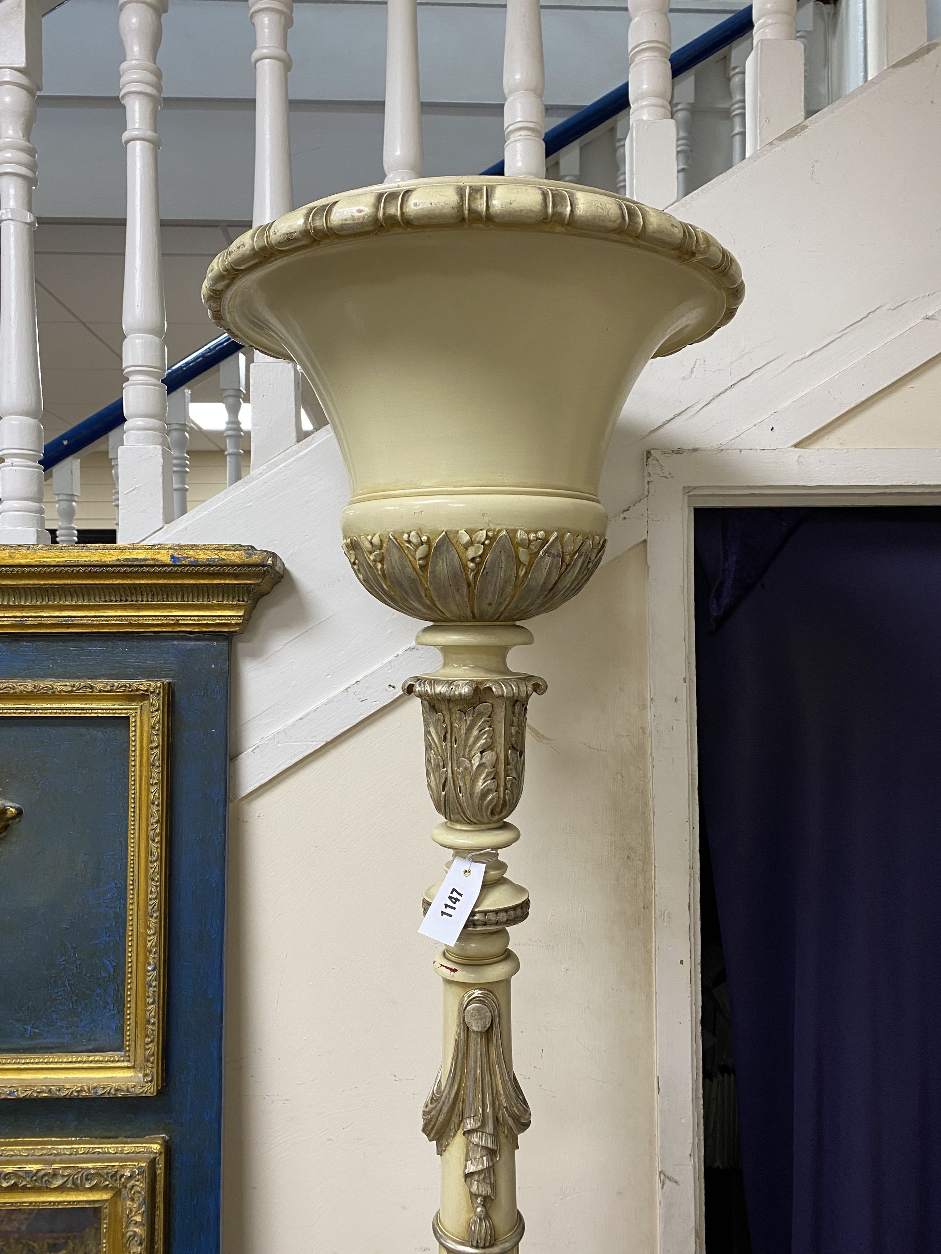 A cream painted part silvered uplighter floor lamp, height 190cm